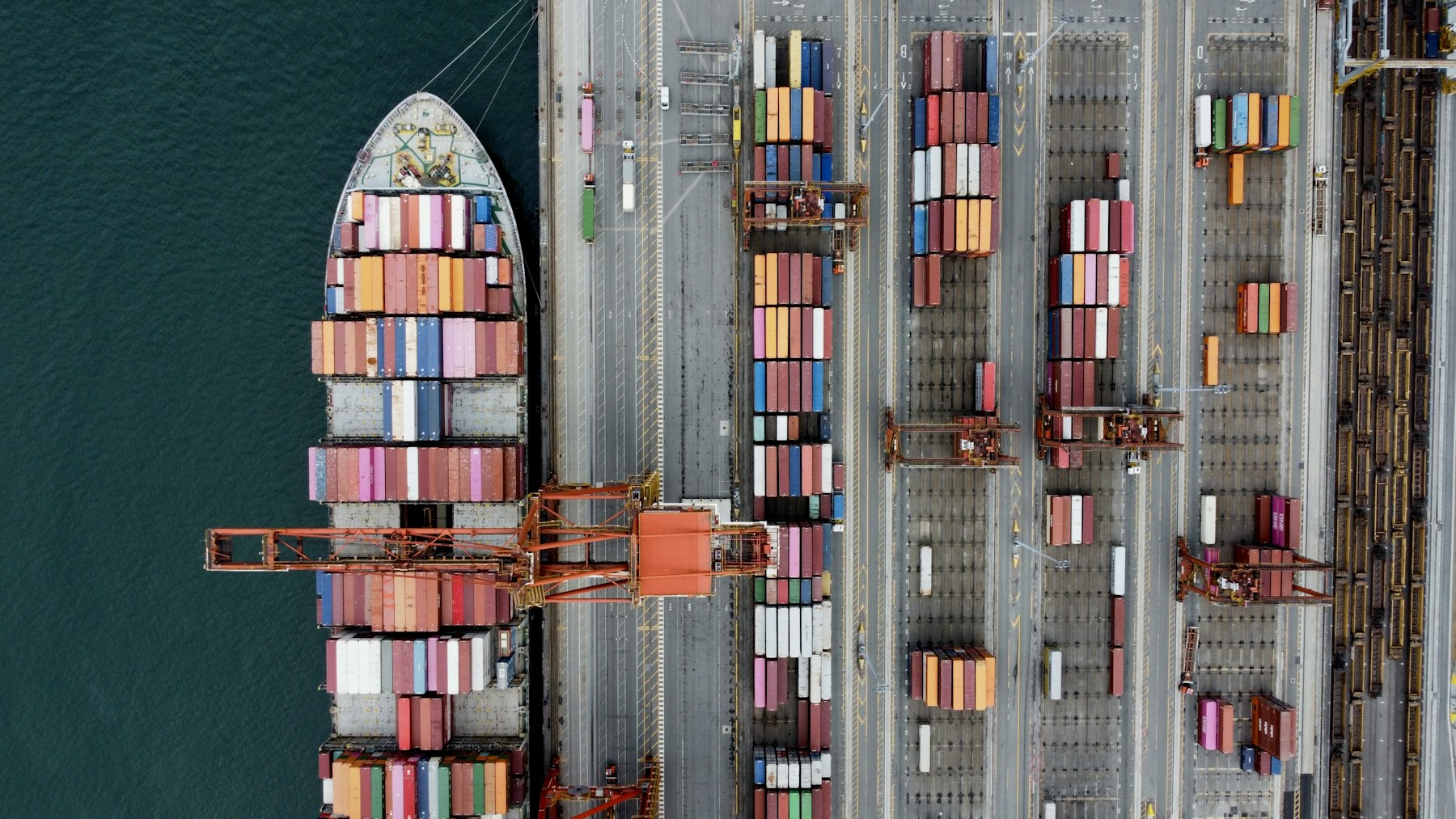 Aerial view of a container ship at a busy international port