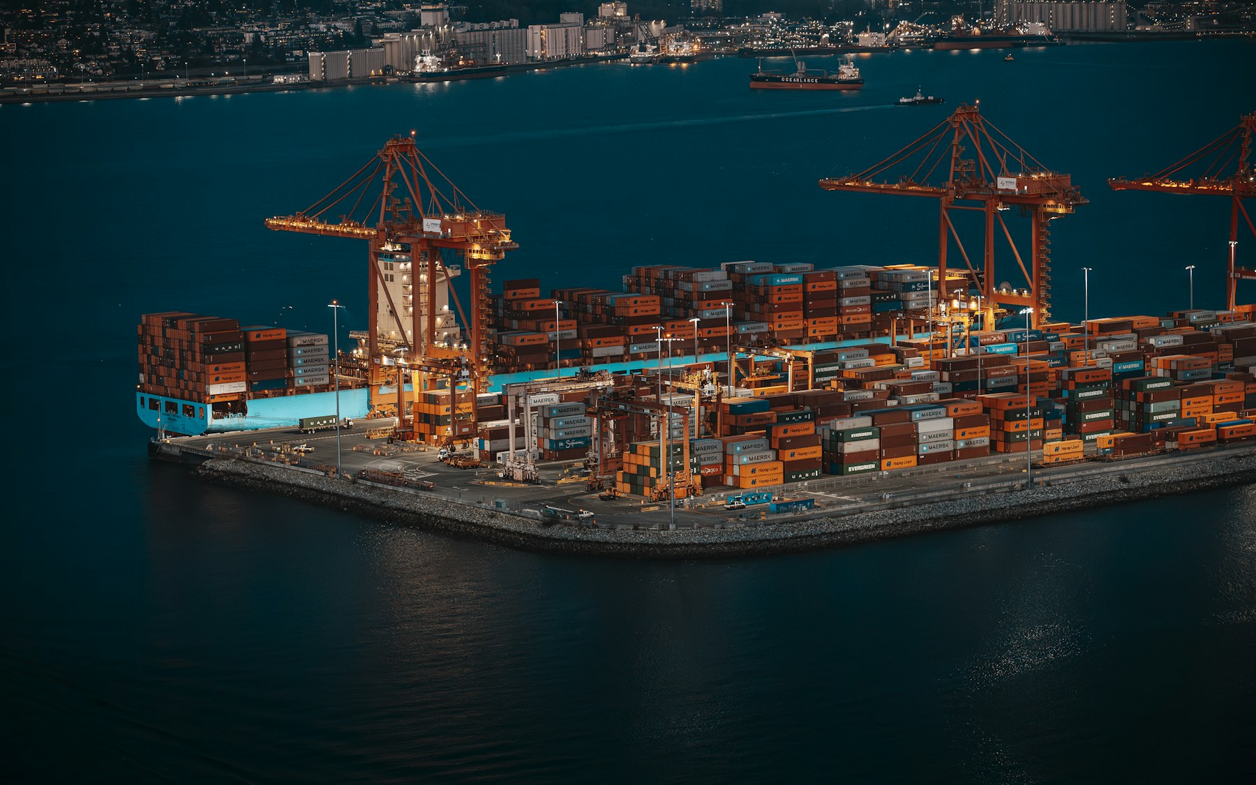 Modern shipping terminal illuminated at night